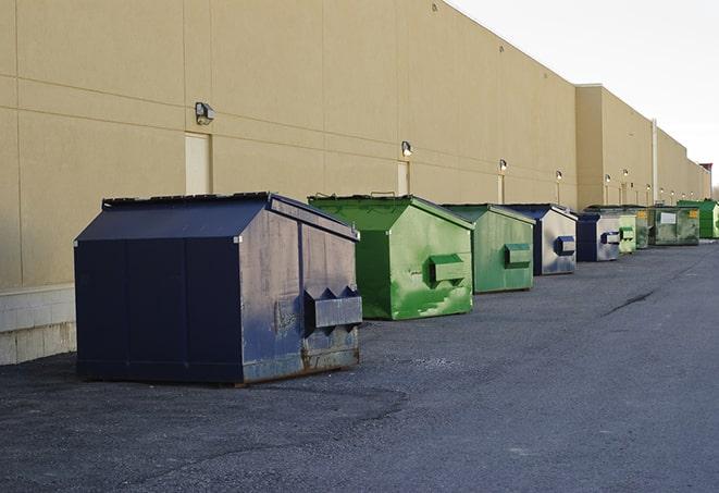 a collection of bright and vibrant dumpsters in a construction zone in Cupertino